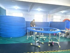 Inflatable dock floats supporting a small boat on calm water