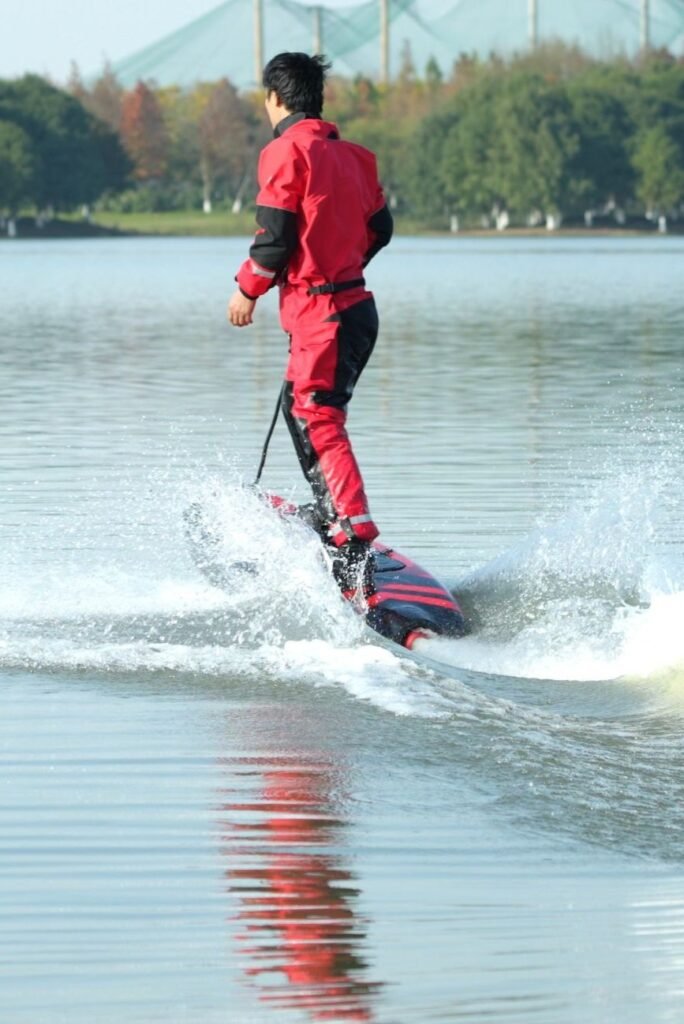 High-speed electric surfboard ride by athlete on carbon fiber Xsea surfboard